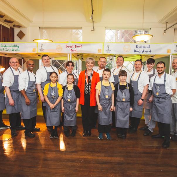 Deborah Homshaw with the CH&CO chefs and pupils from Charlton Manor Primary School